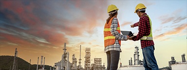 Engineers wearing PPE working at energy construction site