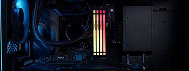 Gaming PC with first-person shooter game on the monitor on the desk at home
