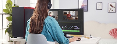 a girl at her desk editing content on her computer