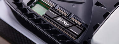 Kingston FURY Renegade SSD with heatsink installed in a PlayStation 5 Gaming Console