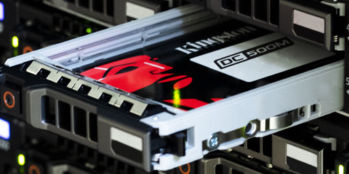 SATA SSD in a server caddy pulled halfway out of a server storage bay