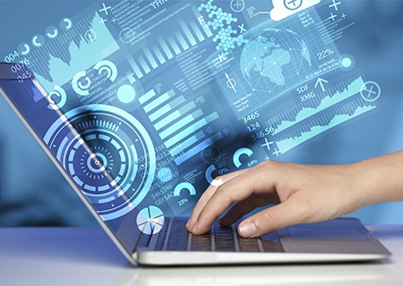 a hand working on a laptop with a report illustration projected outside the monitor